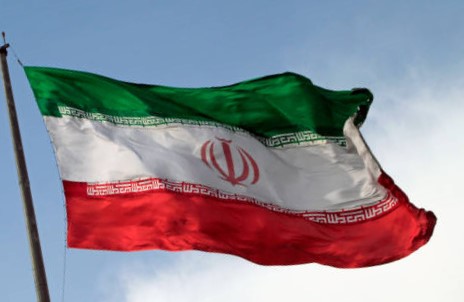 A Big Flag Of Iran Waving In The Wind In Tehran, Iran.